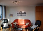 Wohnzimmer mit gemütlichen Sitzgelegenheiten in der Inselblume 55 auf Fehmarn