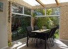 Wintergarten mit Sitzgelegenheiten in der Fewo in Burg auf Fehmarn für 4 Personen