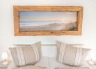 Bild mit Strand und Meer im Schlafzimmer der Ferienwohnung auf Fehmarn