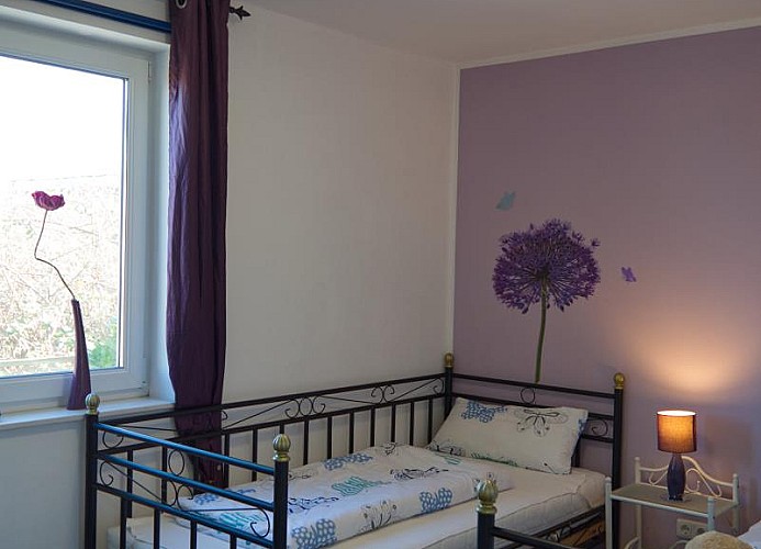 2. Schlafzimer mit 2 Einzelbetten in dem Ferienhaus auf Fehmarn